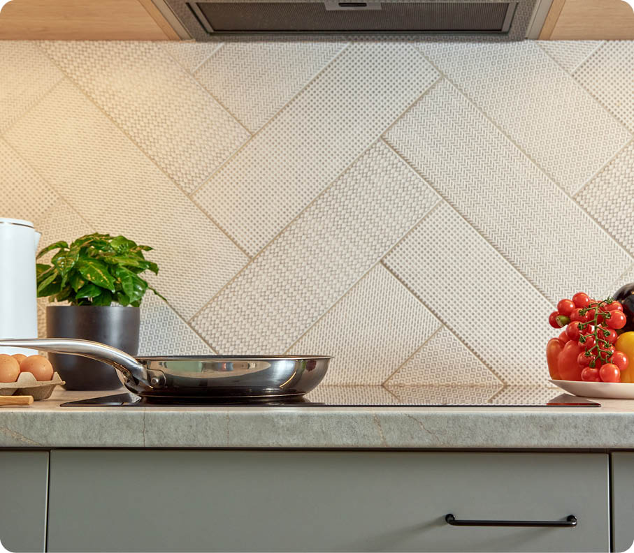 Modern kitchen appliance, Induction stove with steel frying pan, Front view of kitchen interior 