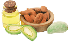 Green and peeled almond and essential oil over white background